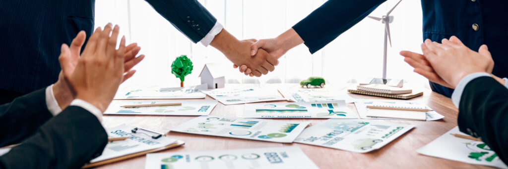 business people hand shake in eco corporate meeting room. trailblazing