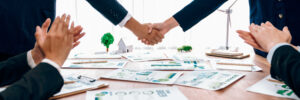 business people hand shake in eco corporate meeting room. trailblazing